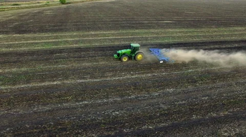 Aerial: Tractor plowing the soil on sunset Stock Footage 55809216
