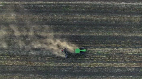 Aerial: Tractor plowing the soil. Top view. Stock Footage 55807445