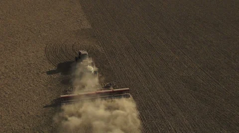 Aerial - Tractor seeding spring wheat Video stock 22480338