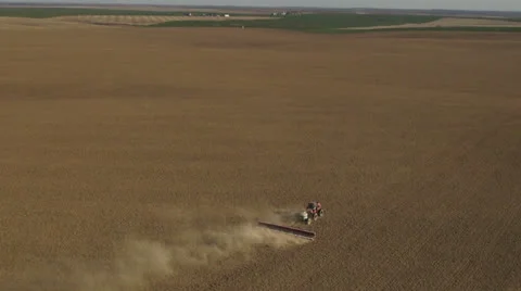 Aerial - Tractor seeding spring wheat Video stock 22485797