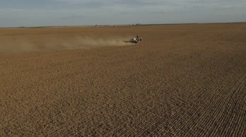 Aerial - Tractor seeding spring wheat Video stock 22490519