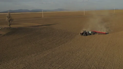 Aerial - Tractor seeding spring wheat Stock-Footage 32256297