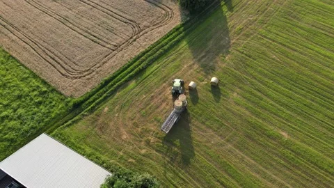 Aerial Tractor Working with Hay Balls Stock Footage 134891981