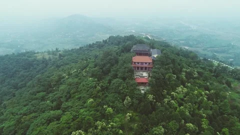 Aerial Traditional Buddhist Temple Complex Nestled Within Green Mountain Forest Stock Footage 342091450
