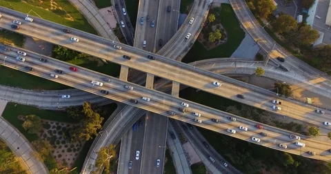Aerial of traffic on intersecting highways on a sunny day Stock Footage 81532909