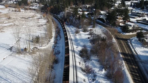 Aerial of train approaching Stock Footage 87716941
