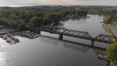 Aerial train bridge orbit left chateauguay river quebec H.264 2pass Stock Footage 97418952