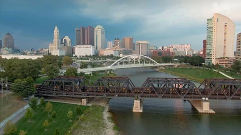 Aerial: Train crossing bridge on the Scioto River, Columbus, Ohio, USA. 20 Stock Footage 127394118