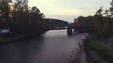 Aerial: Train Crossing a River Video stock 56300935