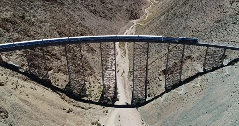 Aerial train drives through old metal bridge. Tren de las nubes, salta 스톡 동영상 126602857