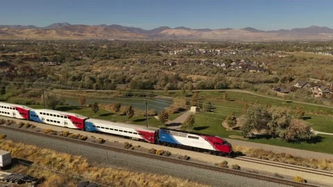 Aerial of train going through suburban town in western United States Stock Footage 146924201