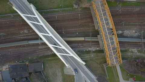 Aerial of Train Going Under Road Overpass Video stock 89681560