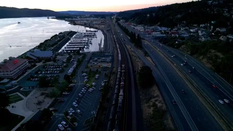 Aerial of Train Moving Through Train Yard at Sunset  Video stock 248663747