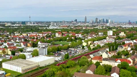 Aerial Train passing - Skyline in background 4K Stock Footage 142061420