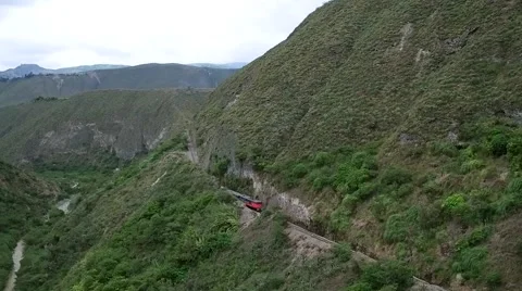 Aerial of train passing through beautiful mountain Stock Footage 65826783