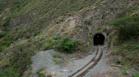 Aerial of train passing through a tunnel Stock Footage 65877935