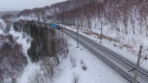 Aerial train snaking through winter rural landscape locomotive Travel railway 4k Stock Footage 317963735
