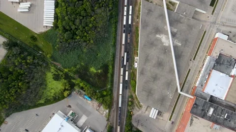 Aerial of train through generic business district Stock Footage 232450833