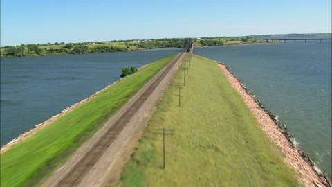 Aerial of train track on bridge over river, Flight And Reveal Old Railway Bridge Stock Footage 109451498
