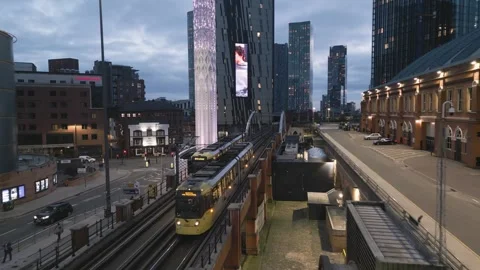 Aerial, trams and Tower of light, Deansgate, Manchester, England Stock Footage 257556344