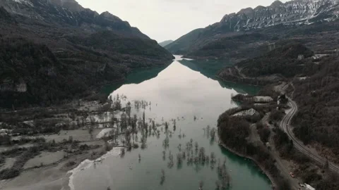 Aerial - Tranquil mountain landscape featuring Ibaneta Reservoir reflecting Video stock 306743474