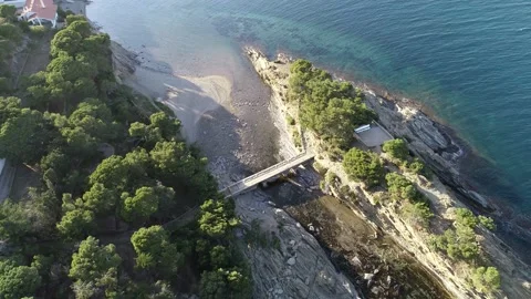 Aerial transition between the bridge and the skyline of Cadaques Stock Footage 137013073
