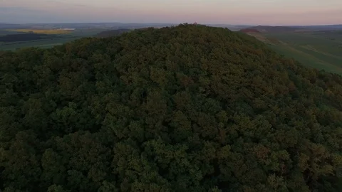 Aerial of tree covered mountain at dusk Stock Footage 116203827