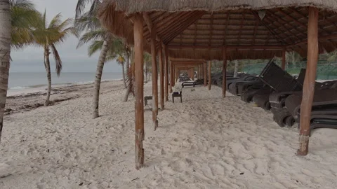 Aerial Tripod Low Angle Beach Chairs 6K LOG Stock Footage 199868824
