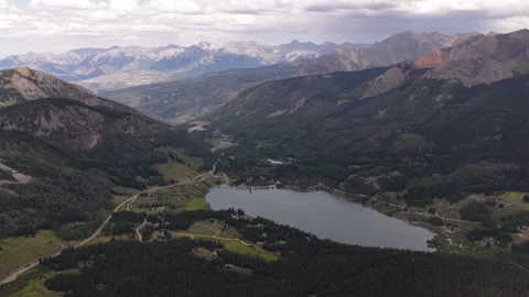 Aerial of Trout Lake and San Juan mountain range in Telluride Colorado in summer Stock Footage 342070153