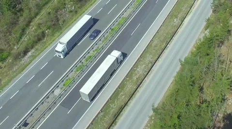 AERIAL: Truck transporting the cargo on a highway Stock Footage
