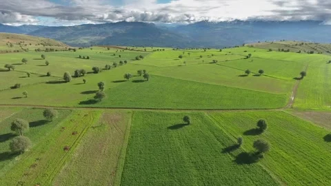 Aerial Turkey farmland patchwork fields hills cultivated plains - Clouded Skies Stock Footage 339568153