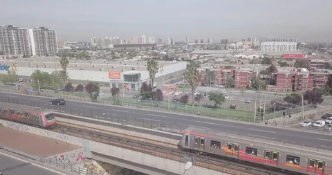 AERIAL TURNAROUND OF 2 TRAIN METRO SUBWAY PASSING BY 4K VIEW OF THE CITY Stock Footage 101334318