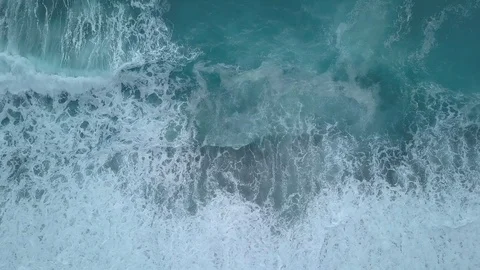 Aerial turquoise waves break on empty beach. Clean sea from bird's eye view Stock Footage 109664536