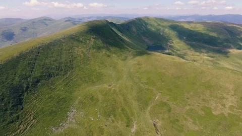 Aerial of a twisting Carpathian range with dark cloud shadows in summer Stock Footage 93845583