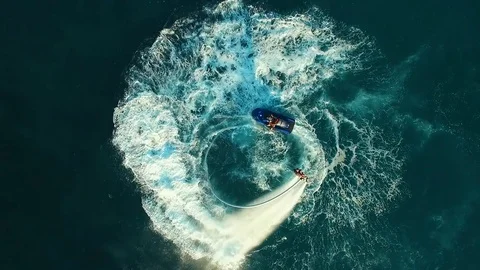 Aerial: Two men flying on flyboard near the boat. Stock Footage 70453115