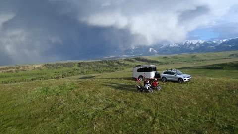 Aerial of two motorcyclists having break on scenic place, Wyoming USA Stock Footage 124220220