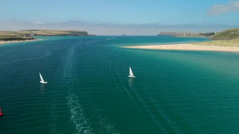 Aerial of Two Small Sailing Boats near Rock and Padstow in Cornwall. Stock Footage 115243301