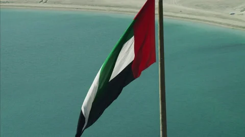 Aerial UAE National Flag flying Port Dubai Dubai Creek UAE Stock Footage