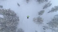 Aerial Unrecognizable Person Making Snow Angles In Fresh Snow During The Winter Stock Footage