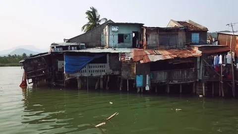 Aerial urban poor rusty houses on river life culture poverty. Asia China Vietnam Stock Footage 107041653