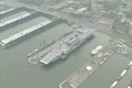 Aerial of USS Intrepid Museum with tilt up to show midtown Manhattan Footage