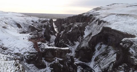 Aerial of valley between snow covered mountains and observation point in winter Video stock 116265238
