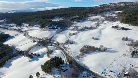 Aerial Valley fields covered by snow during winter on sunny day in Norway 4k Видео 236941302
