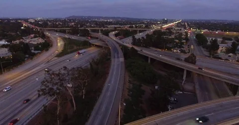 Aerial of vehicles moving on intersecting flyovers at dusk Stock Footage 81532512