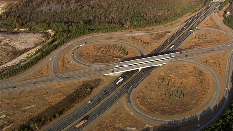 Aerial of vehicles running on highway intersections and overpass, Looping Stock Footage 109141297