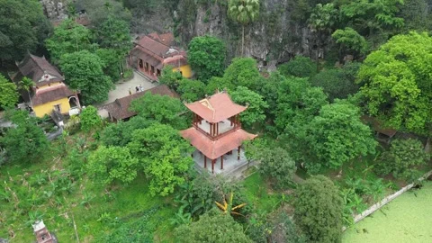 Aerial Vertical Ascent over Bich Dong Pagoda Centered in Ninh Binh Mountains Stock Footage 326664321