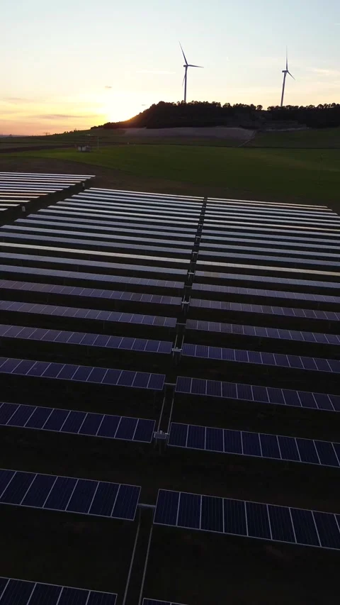 Aerial Vertical Drone View of Solar Panel Farm with Wind Turbines Stock Footage 330453590