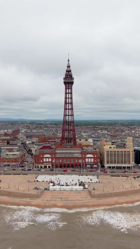 Aerial vertical establishing shot of Blackpool Tower and seafront Stock Footage 340846767