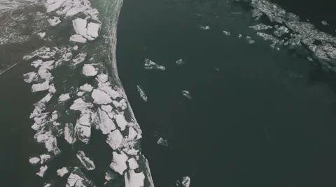 Aerial, vertical - Ice floating on the river 4K Video stock 57252990