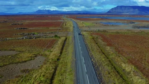 Aerial vertical panoramic view of road with car and Iceland's nature Stock Footage 168076621